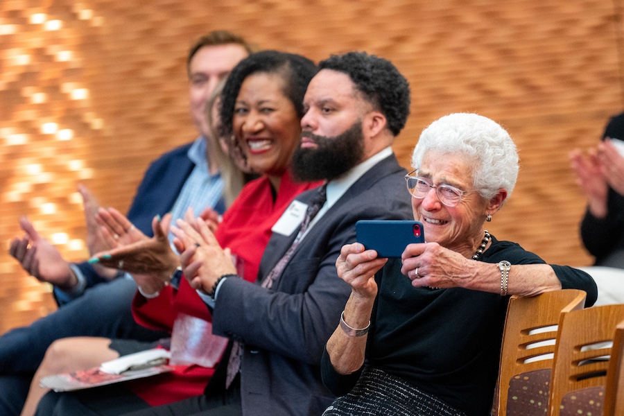 Dorri McWhorter sits applauds with other audience members at the awards ceremony