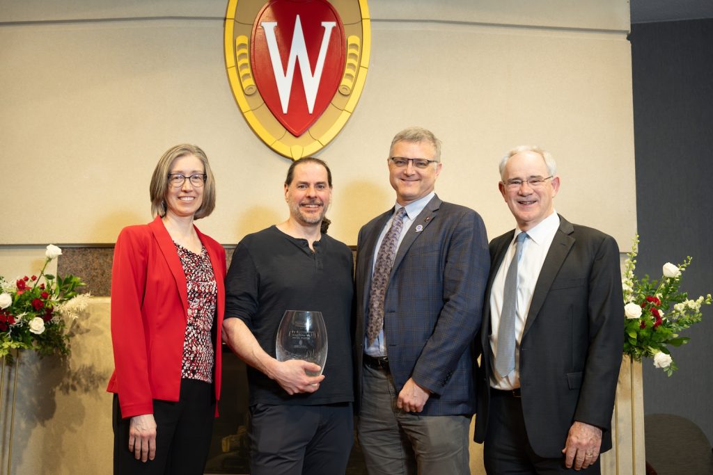 Greg Piefer with his award and three other guests at the Chancellor's awards