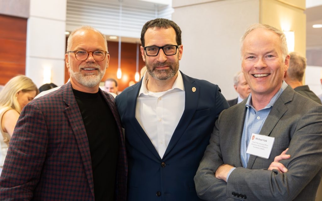 Michael Falk and two other guests at the Chancellor's Awards