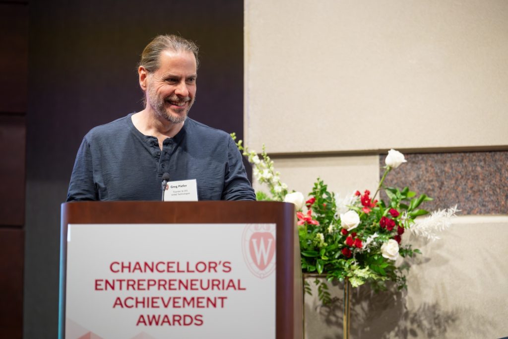 Greg Piefer speaks at podium at the Chancellor's Awards